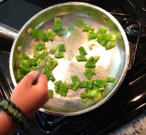 Cook and soften your peppers. My helper's little paw. No 6 year old required in the recipe, but makes it more fun.