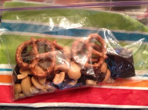 Snack pack. Cashews=protein, Raisins=because he likes them, Pretzels=just because, and Dark Chocolate=A sweet treat 