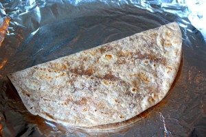 Fold each tortilla in half. 