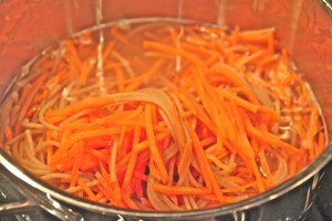 Cook spaghetti for 5 minutes. Add your carrots for 1 minute.