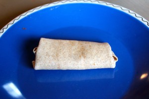 Roll, wrapping in the sides as you go.