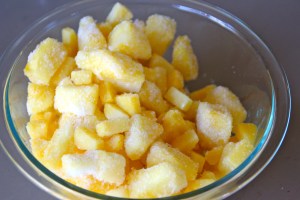 Take some frozen pineapple chunks.