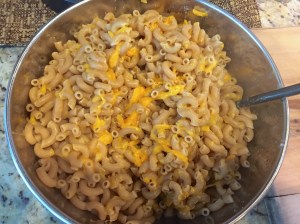 Combined the hot macaroni with the cheese.